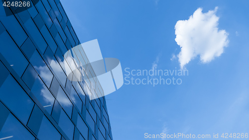 Image of a cloud reflecting in a modern building