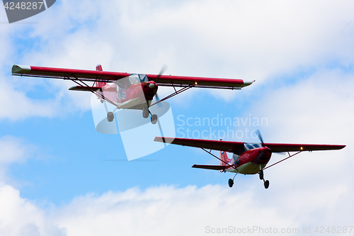 Image of two light airplane in the air