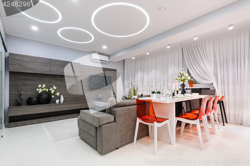 Image of Modern white living room with dining table