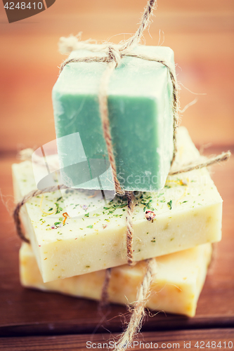 Image of close up of handmade soap bars on wood