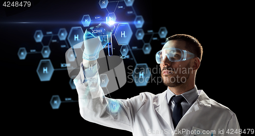 Image of scientist with test tube and chemical formula