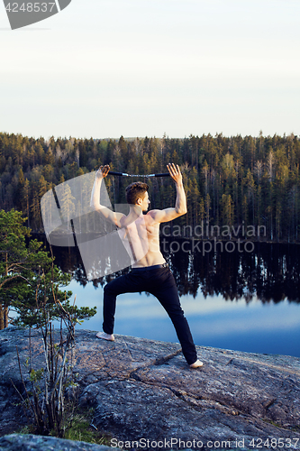 Image of middle age man doing sport yoga on the top of the mountain, lifestyle people outdoor, summer wild nature for training