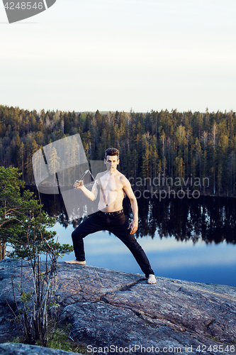 Image of middle age man doing sport yoga on the top of the mountain, lifestyle people outdoor, summer wild nature for training