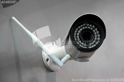 Image of Wireless surveillance camera on the wall of the building