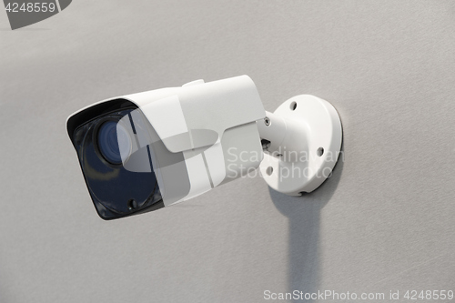 Image of Wireless surveillance camera on the wall of the building