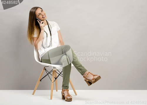 Image of Woman talking on phone