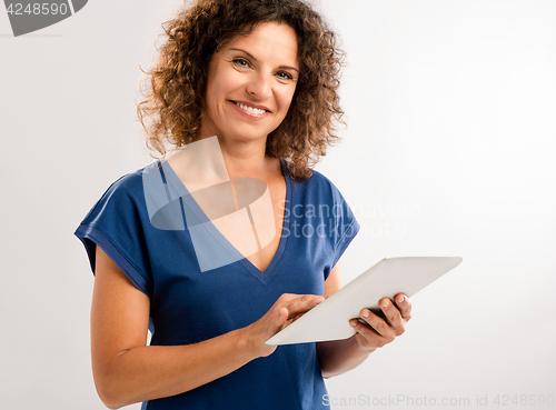 Image of Happy woman working with a tablet