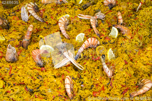 Image of Seafood paella sold at street market stand