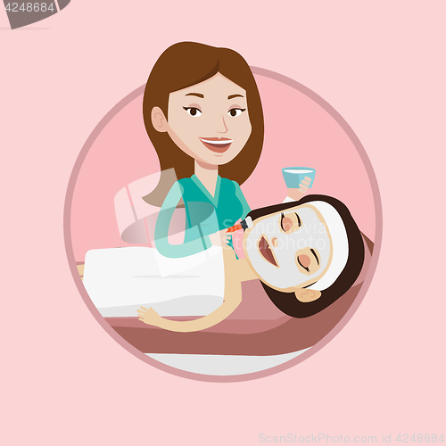 Image of Woman in beauty salon during cosmetology procedure