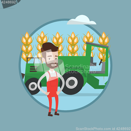 Image of Farmer standing with combine on background.