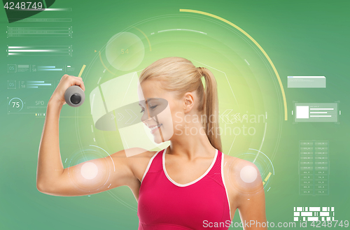 Image of happy sporty woman with dumbbells flexing biceps