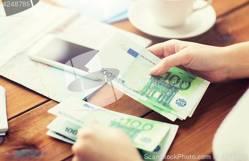 Image of close up of traveler hands counting euro money