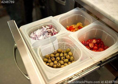 Image of containers with food at restaurant kitchen