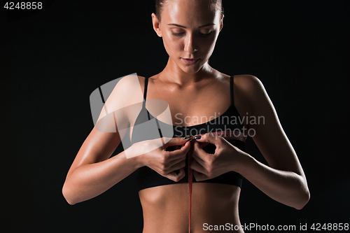 Image of The fit woman measuring perfect shape of beautiful body. Healthy lifestyles concept