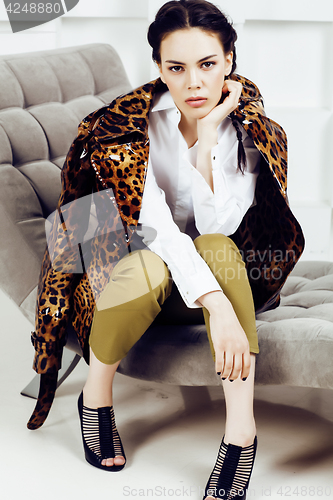 Image of pretty stylish woman in fashion dress with leopard print together in luxury rich room interior, lifestyle people concept, modern brunette together