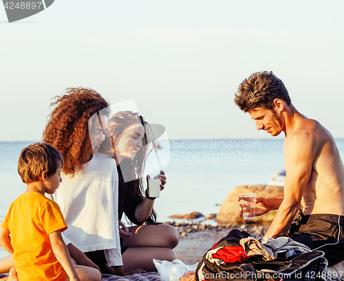 Image of pretty diverse nation and age friends on sea coast having fun, lifestyle people concept on beach vacations close up