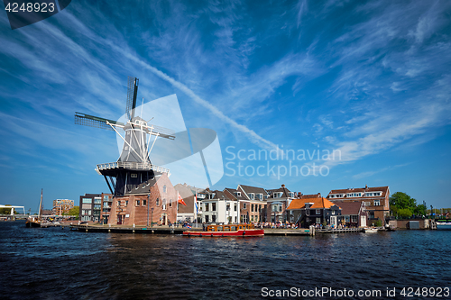 Image of Harlem landmark  windmill De Adriaan on Spaarne river. Harlem,  