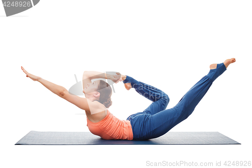 Image of Sporty fit woman practices yoga asana Dhanurasana