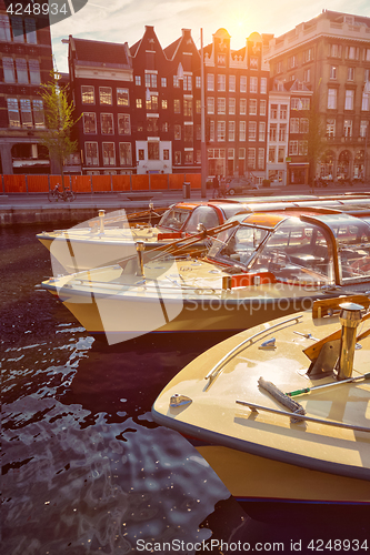 Image of Amsterdam tourist boats in canal