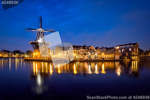 Image of Harlem landmark  windmill De Adriaan on Spaarne river. Harlem,  