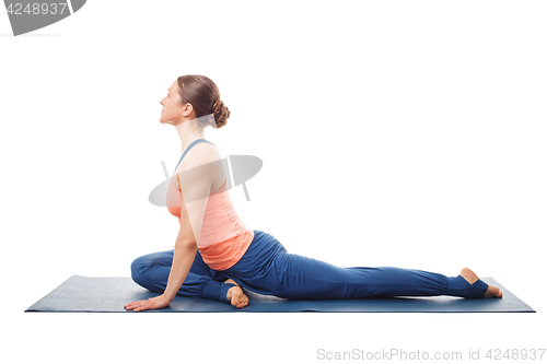 Image of Woman doing yoga asana Eka pada kapotasana