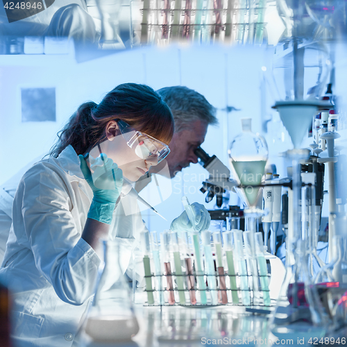 Image of Health care researchers working in scientific laboratory.