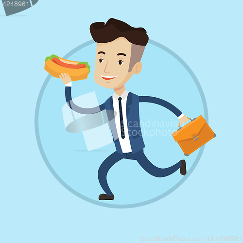 Image of Businessman eating hot dog on the run.