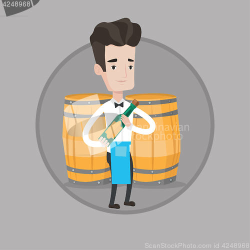 Image of Waiter holding bottle of alcohol.