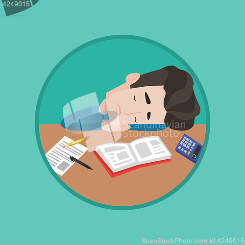 Image of Male student sleeping at the desk with book.