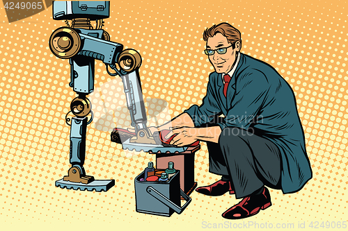 Image of Businessman cleans shoes robot