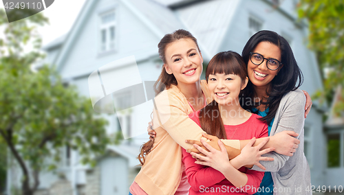 Image of international group of happy women hugging