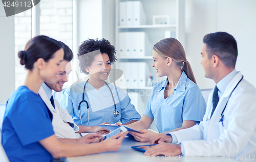 Image of group of happy doctors meeting at hospital office