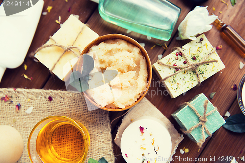 Image of close up of body care cosmetic products on wood