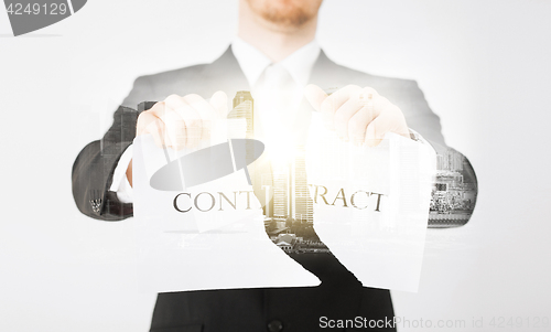 Image of close up of businessman holding contract paper
