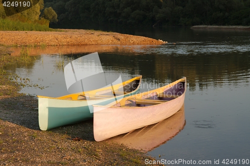 Image of Canoes on the Riverside