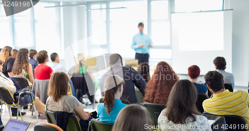 Image of Speaker giving presentation on business conference.