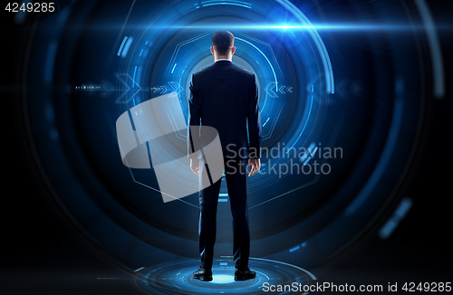 Image of businessman from back with virtual projection