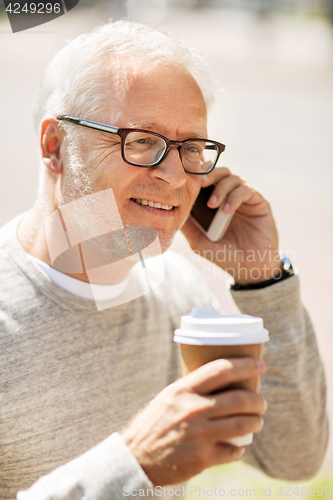 Image of happy senior man calling on smartphone in city