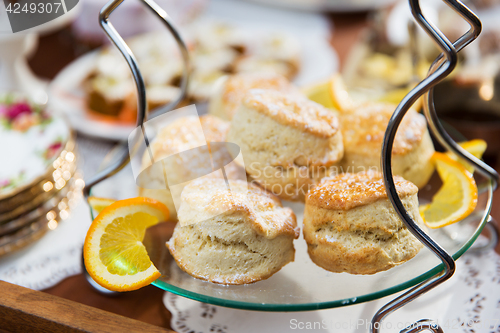 Image of close up of sweet sugared buns on stand