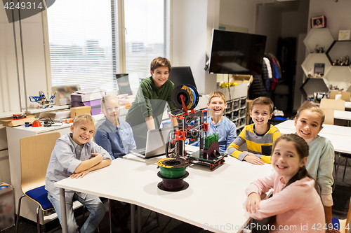 Image of happy children with 3d printer at robotics school