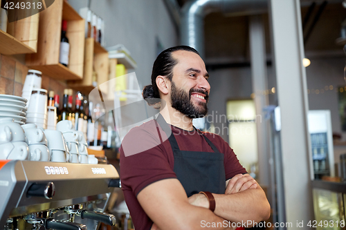 Image of happy man, barman or waiter at bar