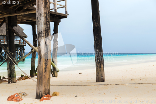 Image of bungalows or stilt houses on tropical resort beach