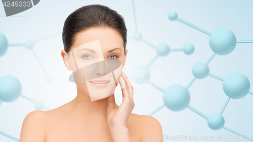 Image of beautiful young woman face with molecules
