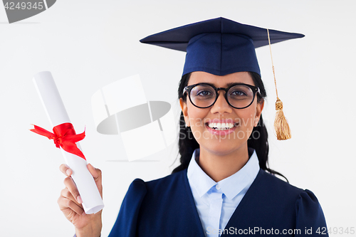 Image of happy bachelor woman in mortarboard with diplomas