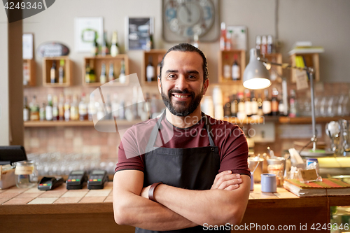 Image of happy man, barman or waiter at bar