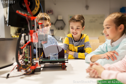 Image of happy children with 3d printer at robotics school