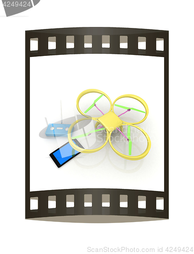 Image of Drone, remote controller and tablet PC. The film strip