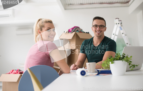 Image of Young couple moving in a new home