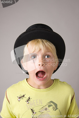 Image of Portrait of a young boy shouting