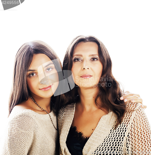 Image of cute pretty teen daughter with mature mother hugging, fashion st